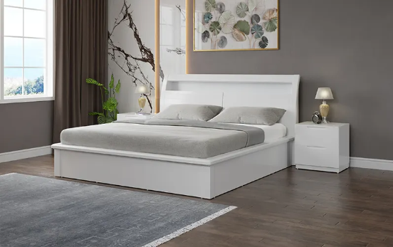 White king side bed with grey pillows